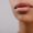 cropped shot of young woman with beautiful lips isolated on grey